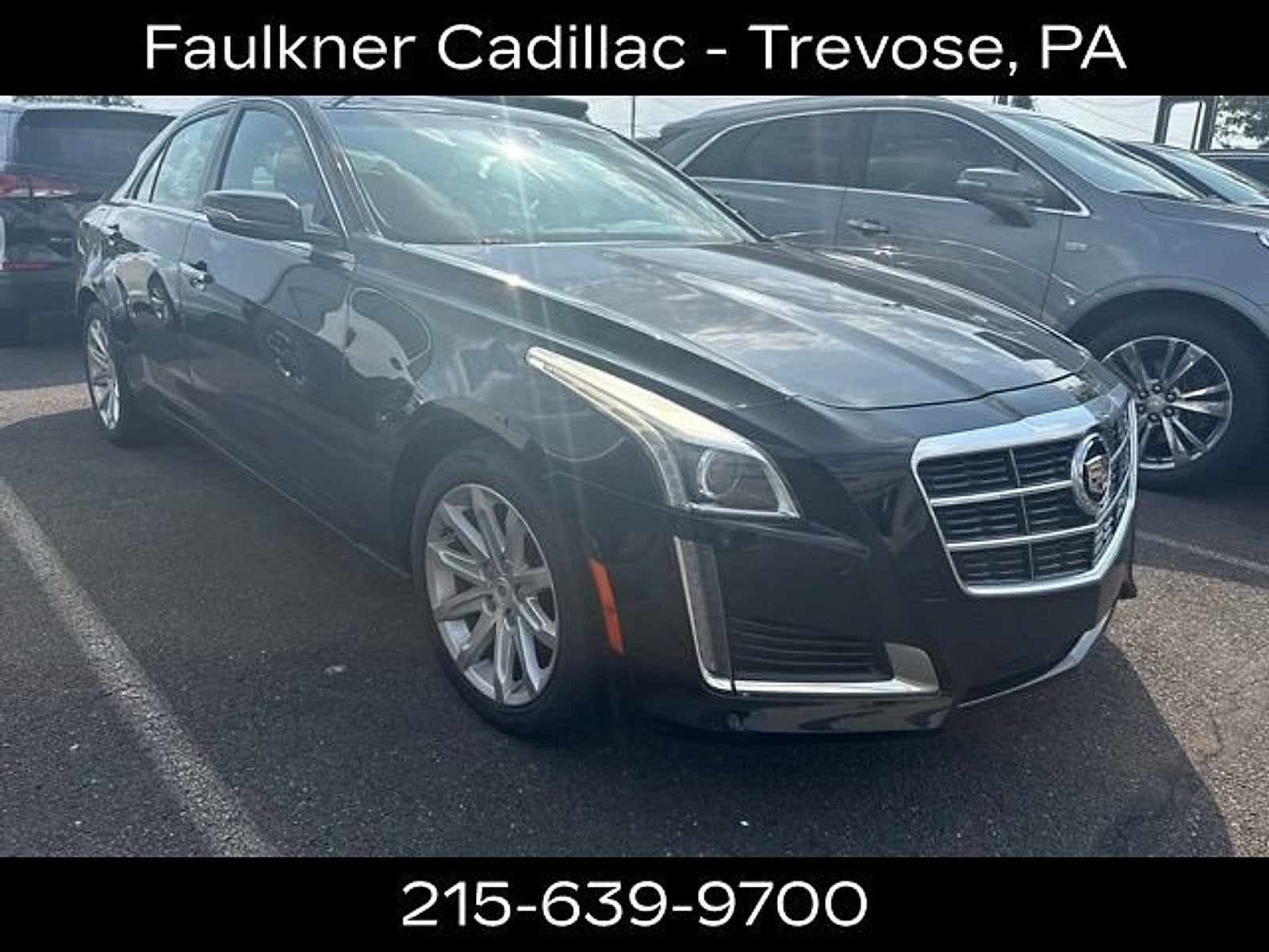 2014 Cadillac CTS Luxury AWD in Black Raven — front three-quarter view