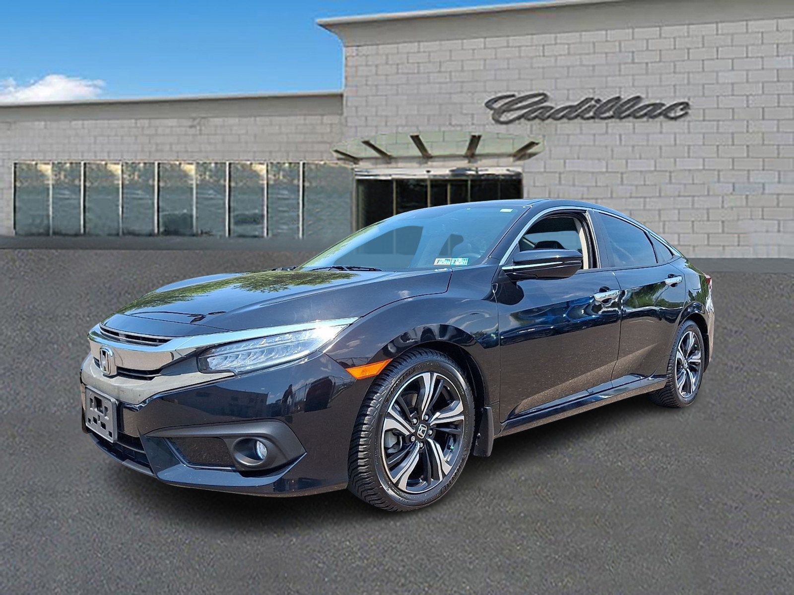 2018 Honda Civic Sedan Touring in Black — front three-quarter view