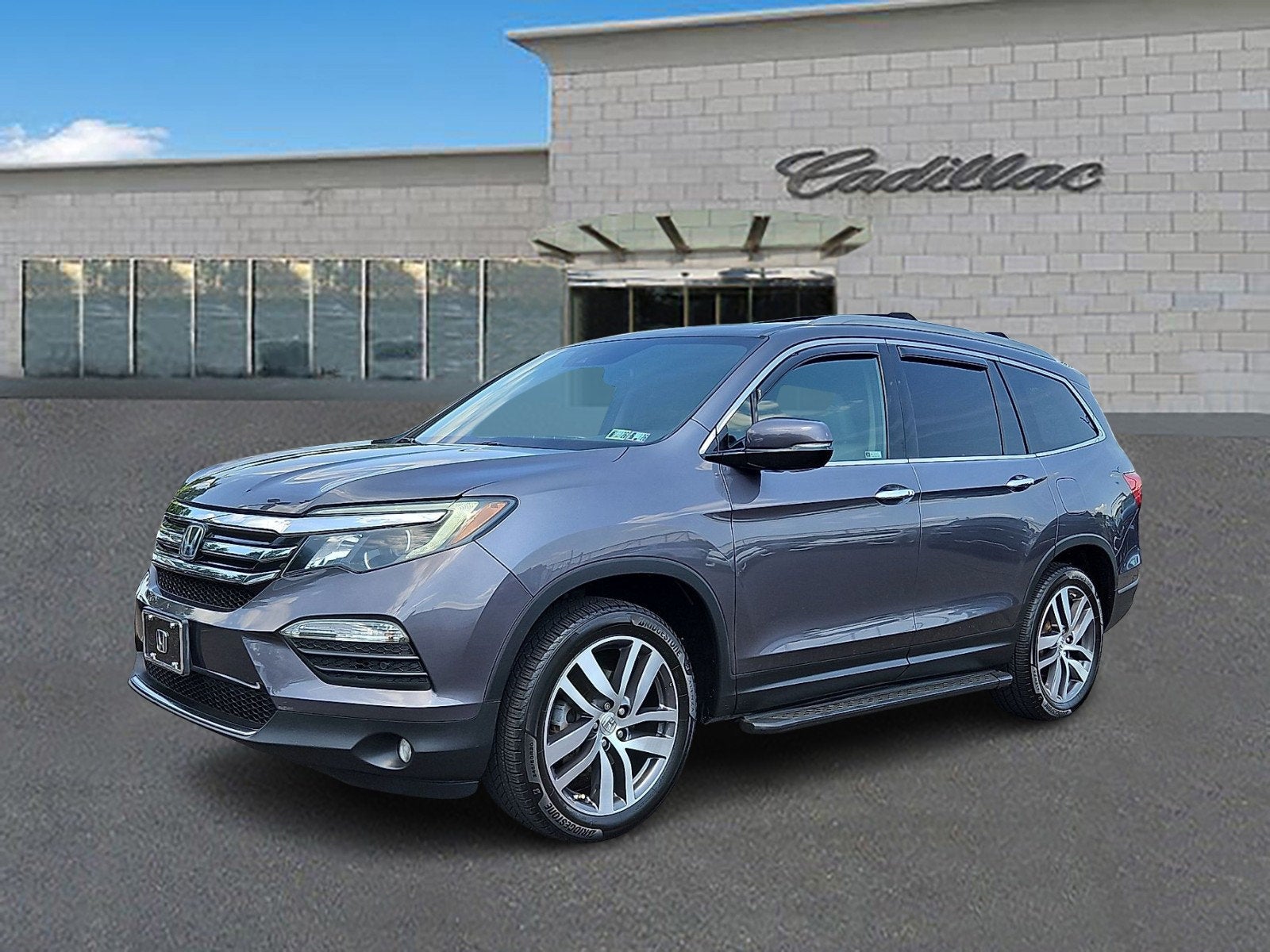2018 Honda Pilot Touring in Gray — front three-quarter view