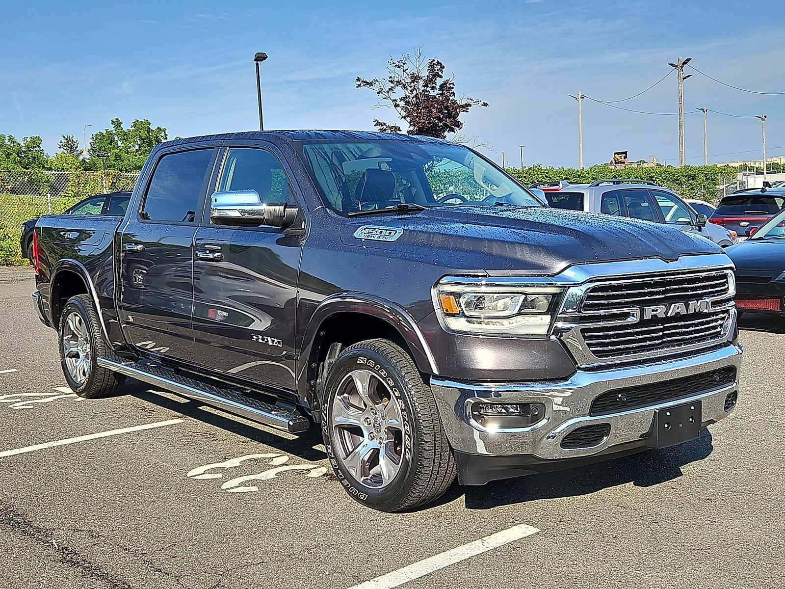 2022 RAM 1500 Laramie Crew Cab 4x4 5'7" Box in Gray — front three-quarter view