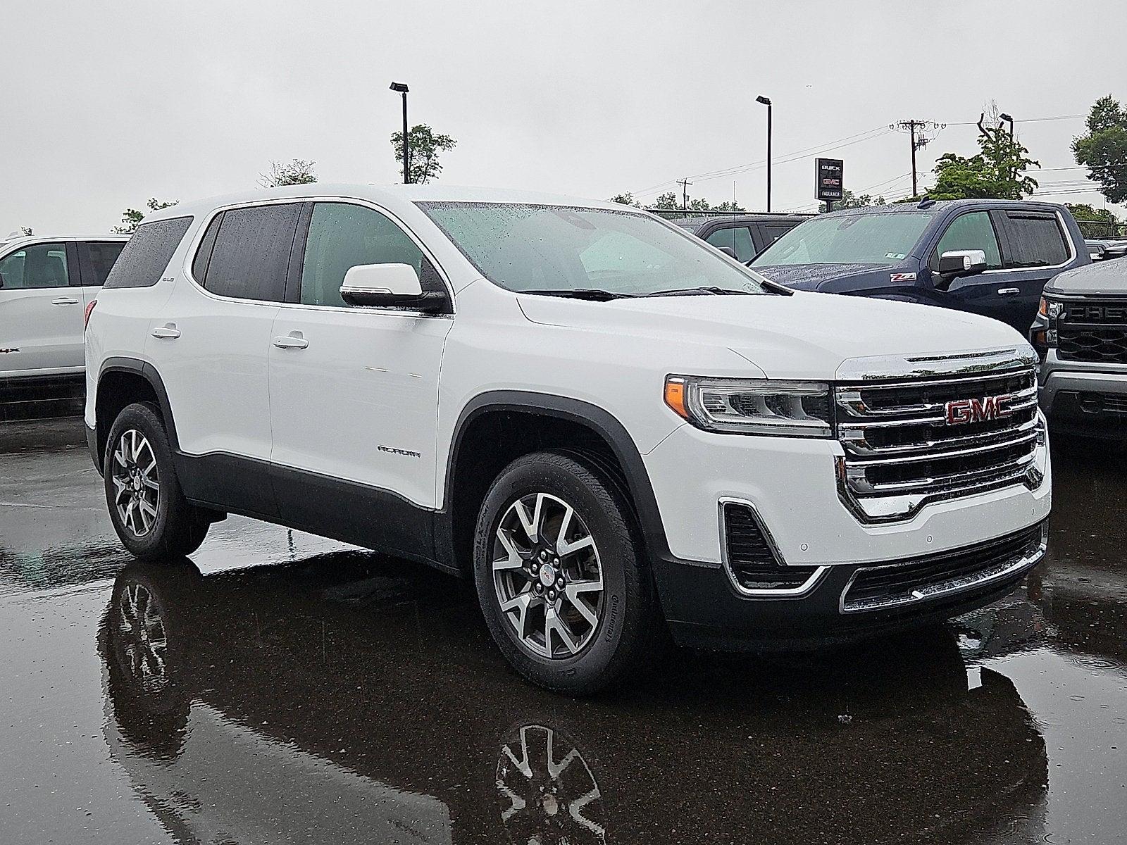 2023 GMC Acadia SLE in Summit White — front three-quarter view