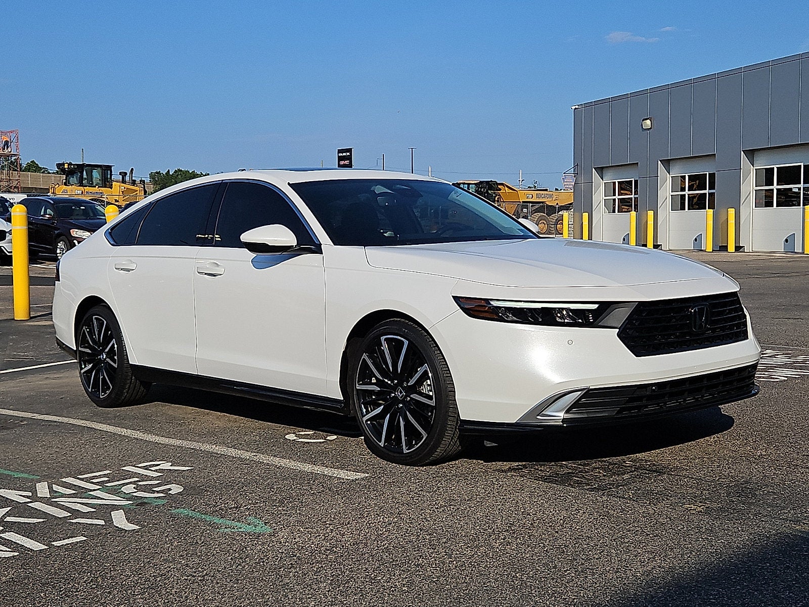 2025 Honda Accord Hybrid Touring in White — front three-quarter view