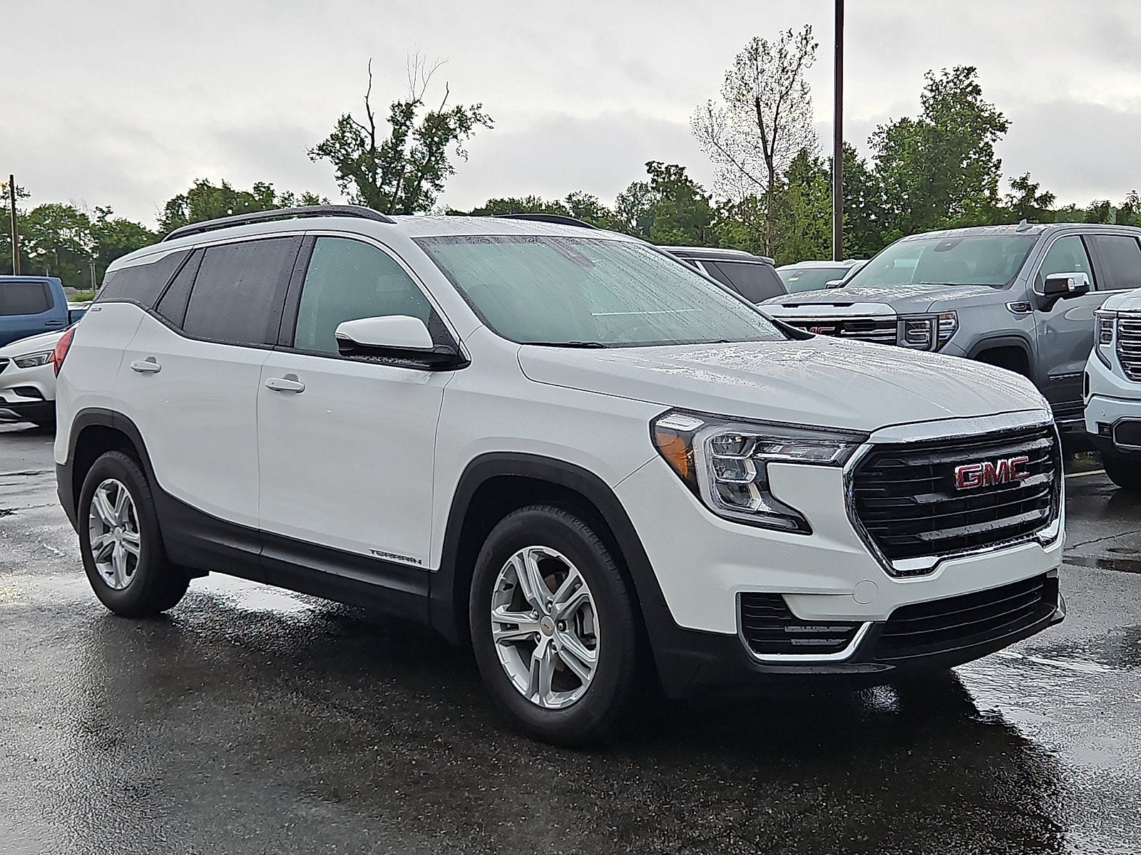 2023 GMC Terrain SLE in Summit White — front three-quarter view