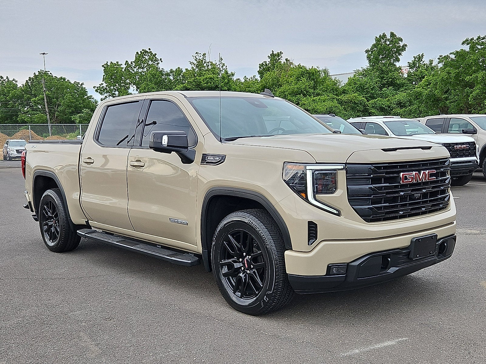 2023 GMC Sierra 1500 Elevation in Desert Sand Metallic — front three-quarter view