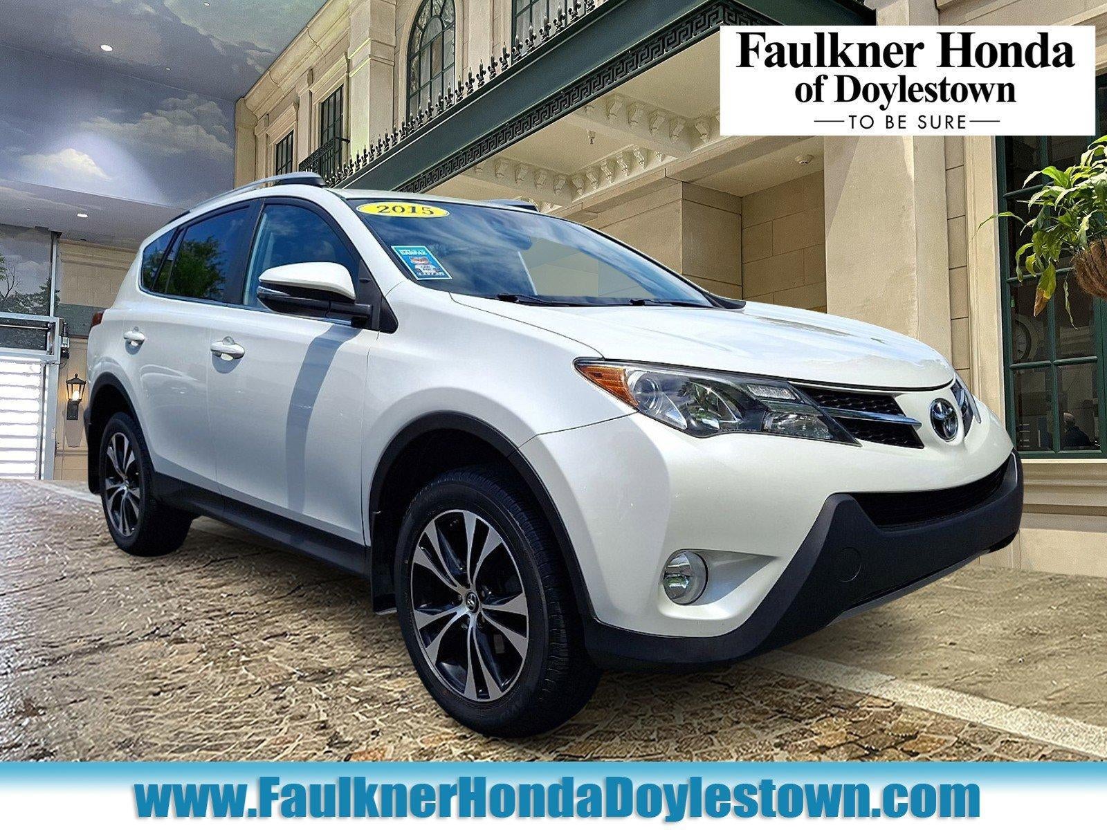 2015 Toyota RAV4 AWD 4dr Limited (GS) in Blizzard Pearl — front three-quarter view