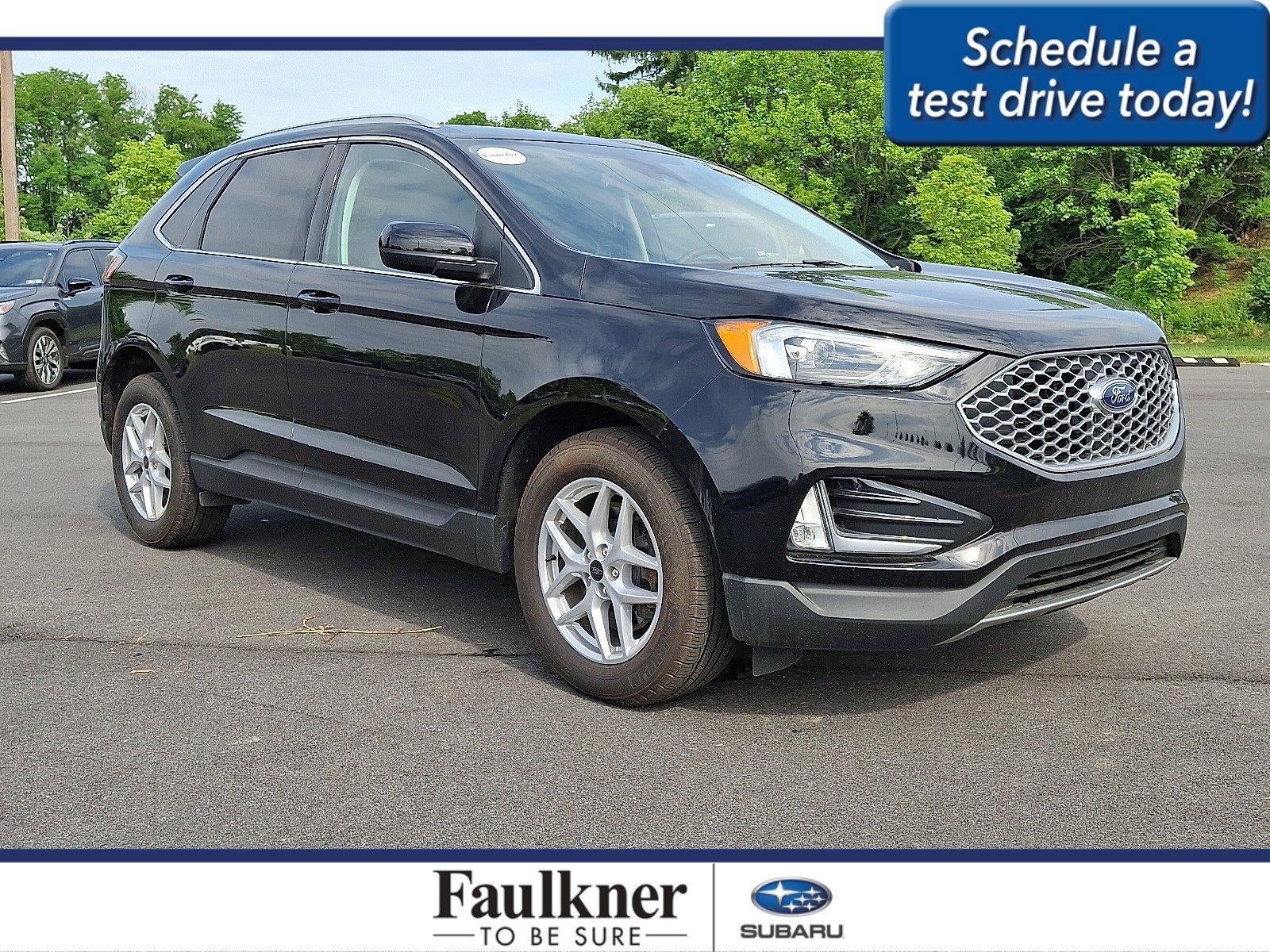 2024 Ford Edge SEL AWD in Agate Black Metallic — front three-quarter view