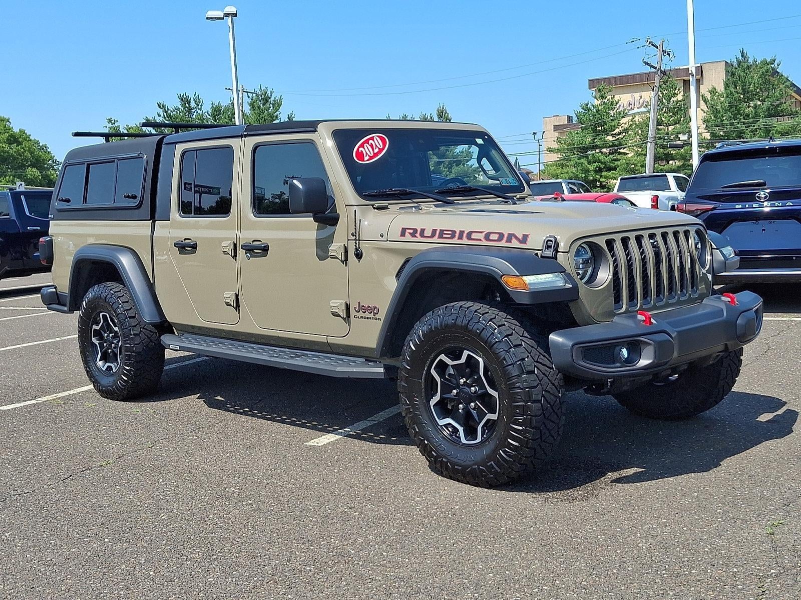2020 Jeep Gladiator Rubicon 4x4 in Gator Clearcoat — front three-quarter view