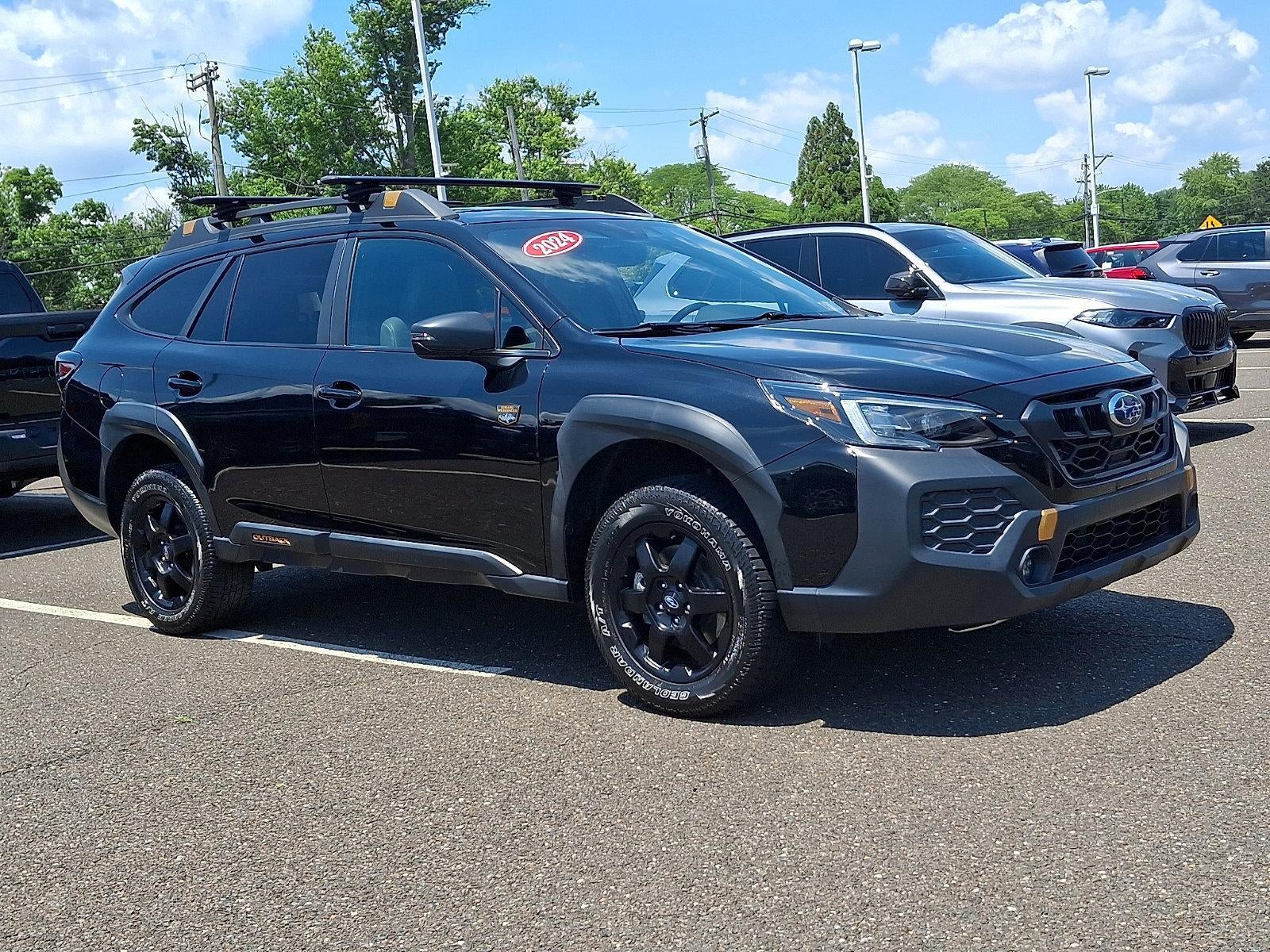 2024 Subaru Outback Wilderness AWD in Crystal Black Silica — front three-quarter view