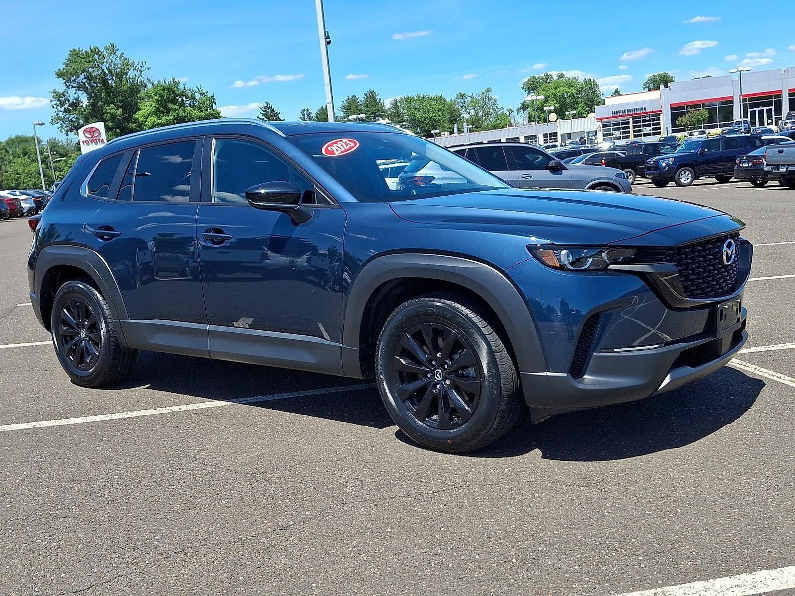 2023 Mazda Mazda CX-50 2.5 S Preferred Plus Package AWD in Ingot Blue Mica — front three-quarter view
