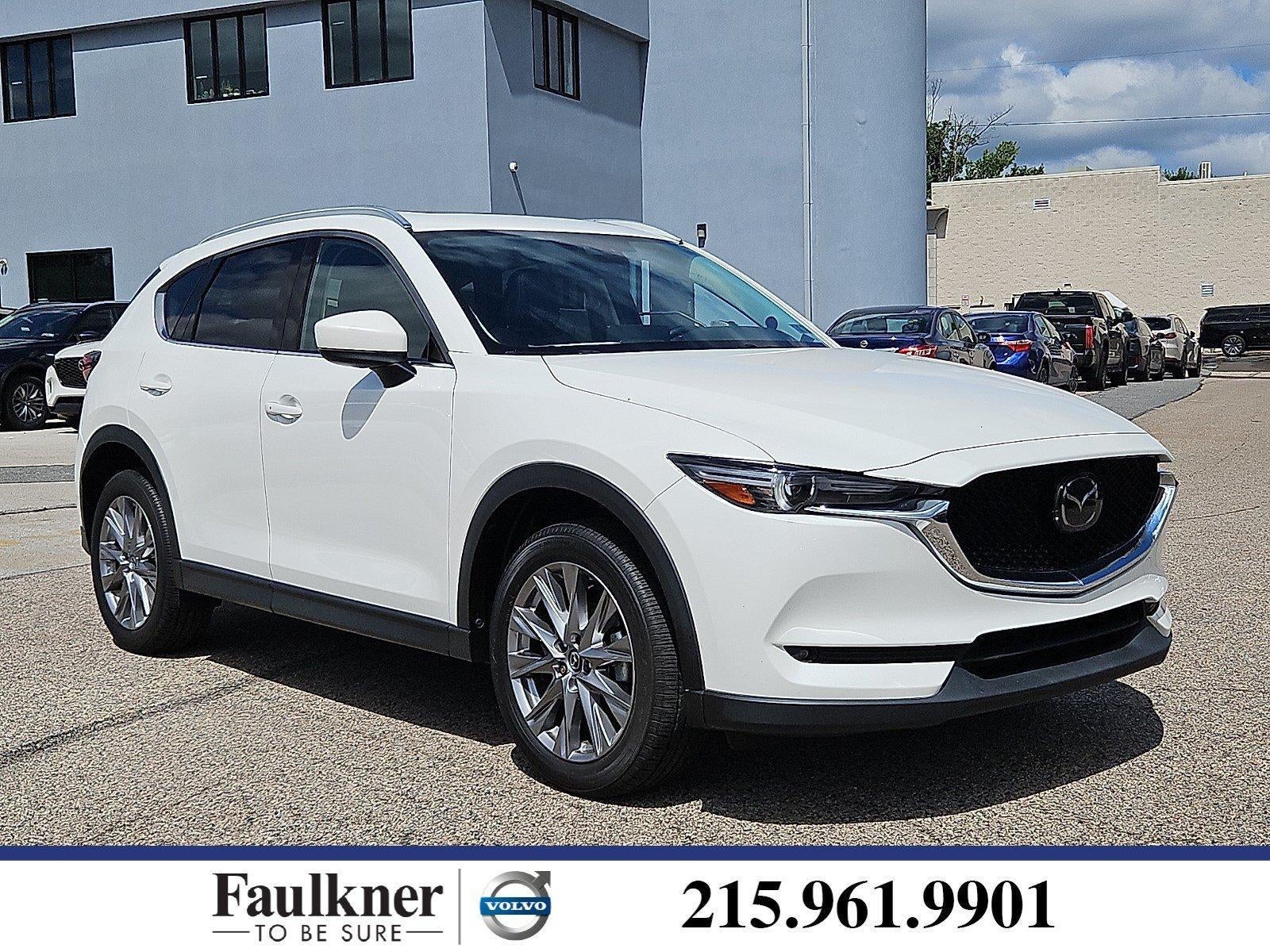 2021 Mazda Mazda CX-5 Grand Touring AWD in Snowflake White Pearl Mica — front three-quarter view