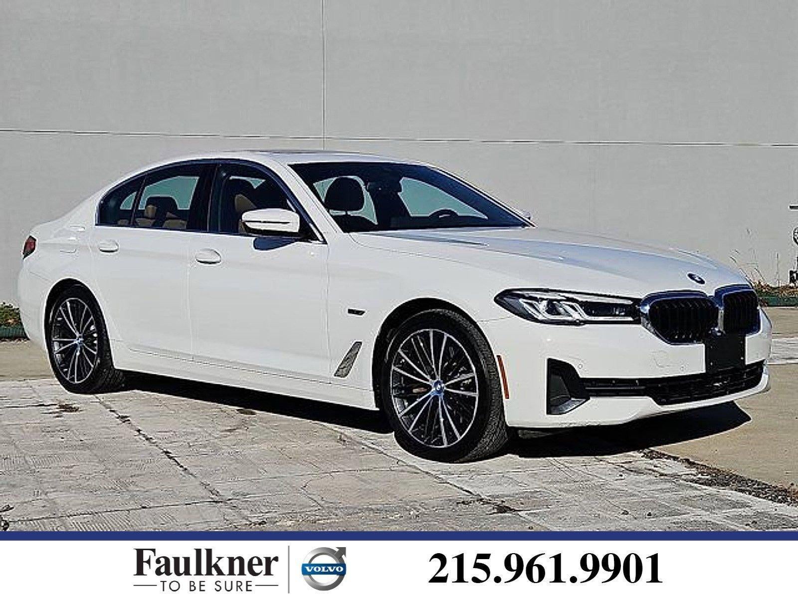 2023 BMW 530e xDrive Plug-In Hybrid in Alpine White — front three-quarter view