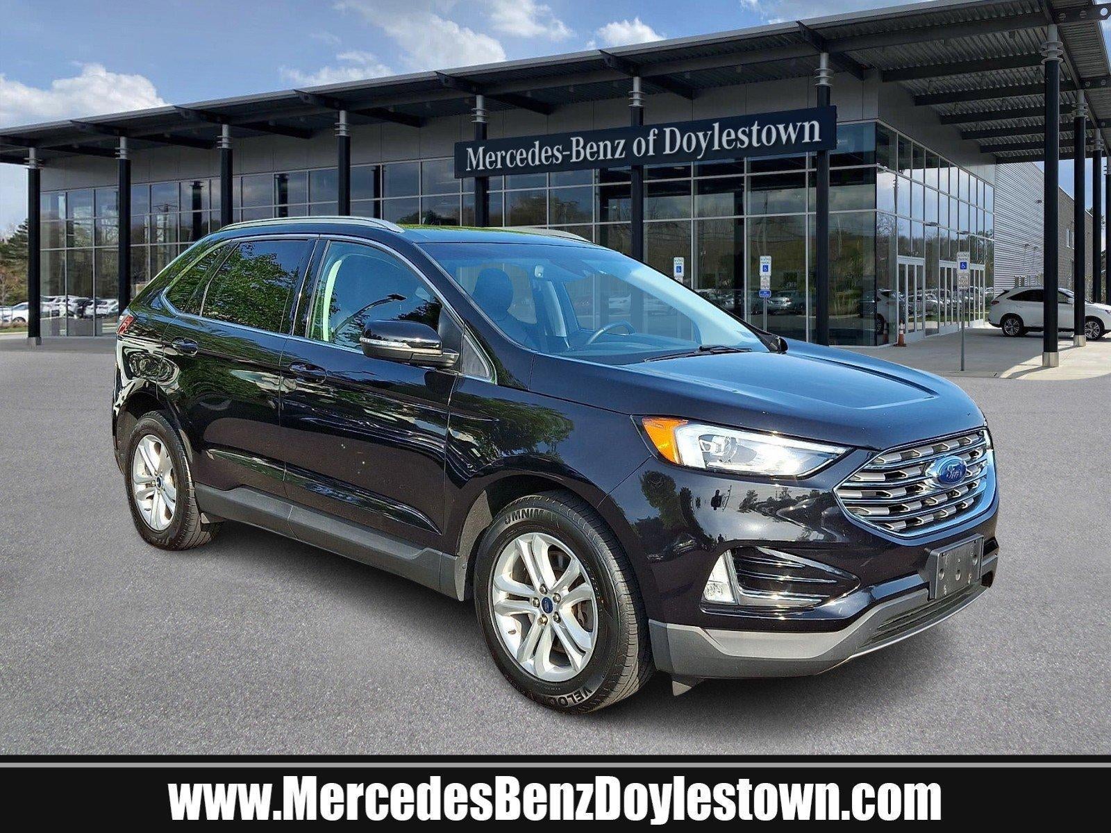 2019 Ford Edge SEL AWD in Agate Black Metallic — front three-quarter view