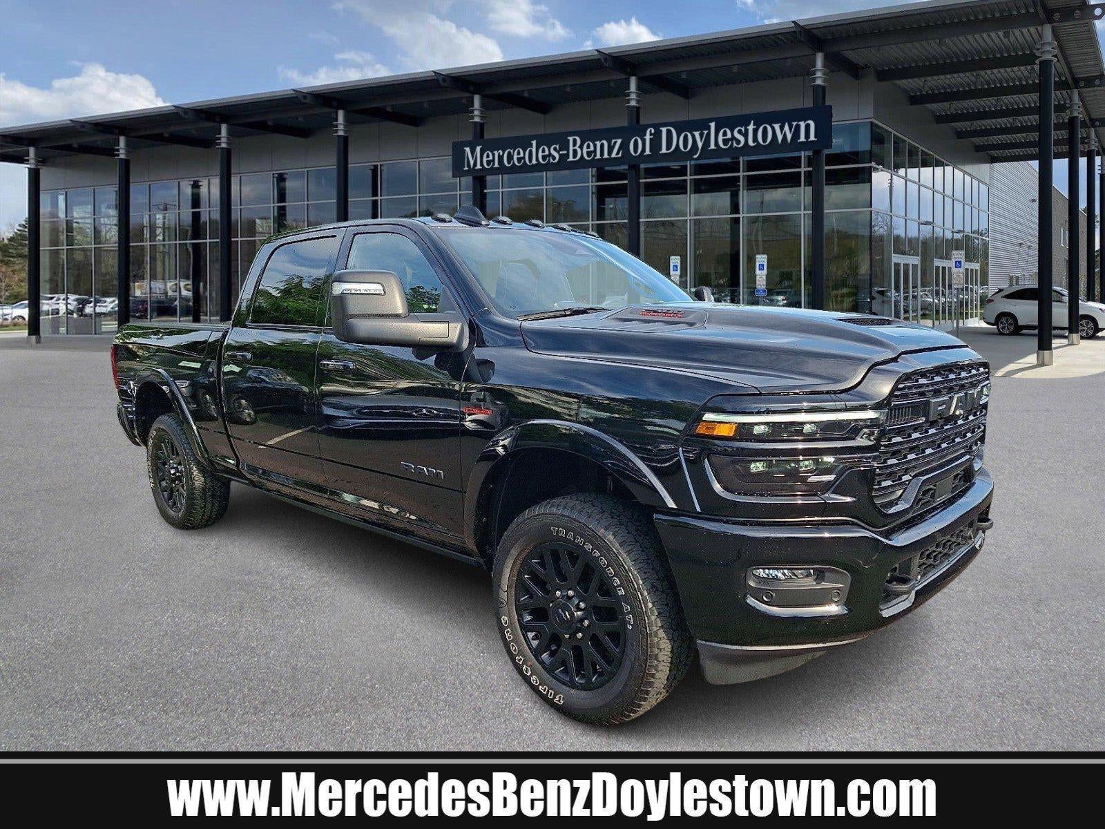 2025 RAM 2500 Limited 4x4 Crew Cab 6'4" Box in Diamond Black Crystal Pearlcoat — front three-quarter view