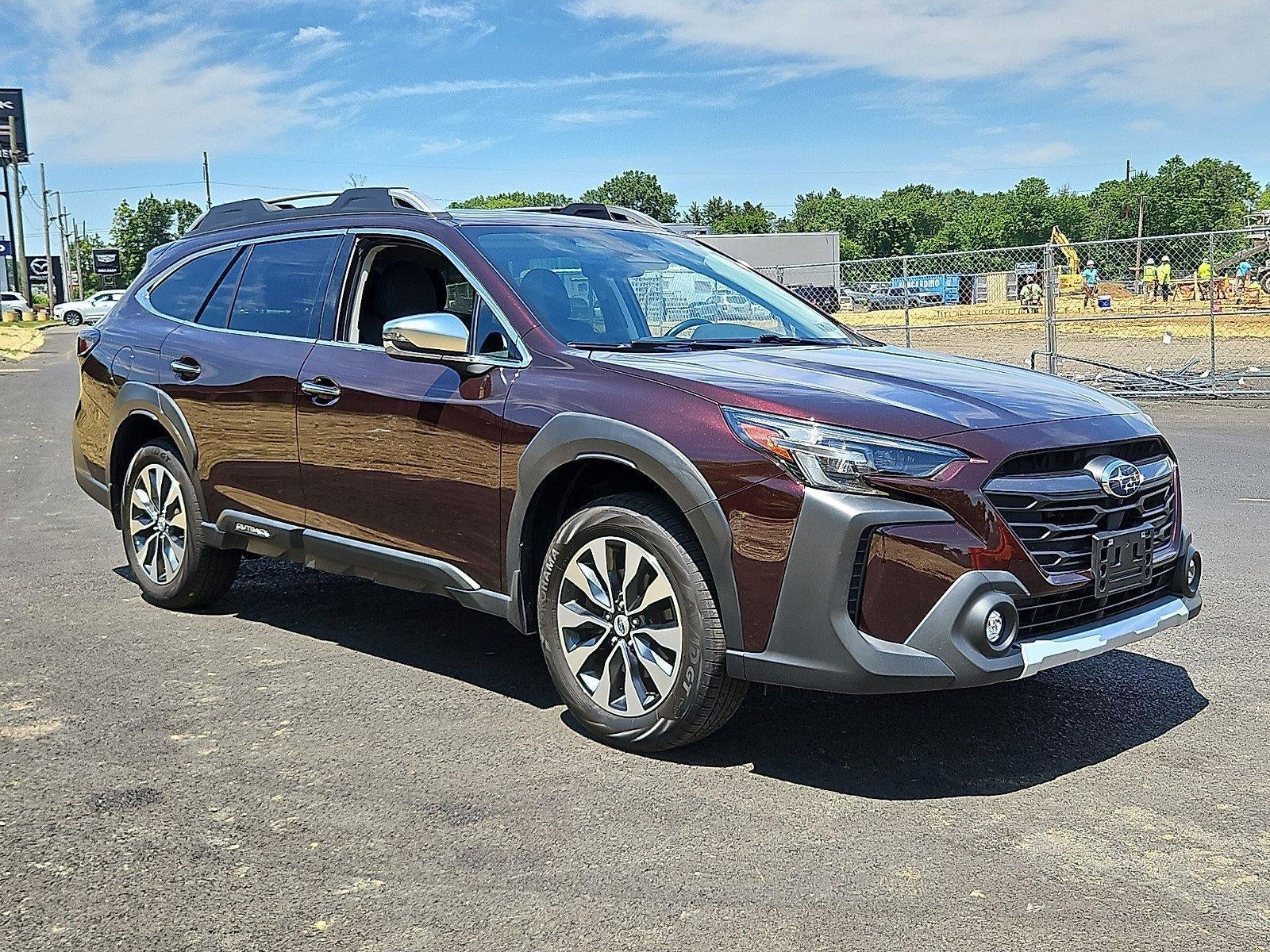 2024 Subaru Outback Touring XT AWD in Dark Mahogany Pearl — front three-quarter view
