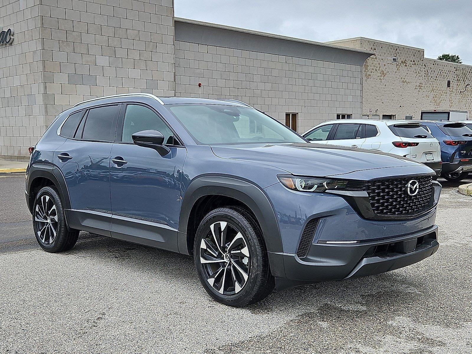2026 Mazda Mazda CX-50 Hybrid Premium Plus AWD in Polymetal Gray Metallic — front three-quarter view