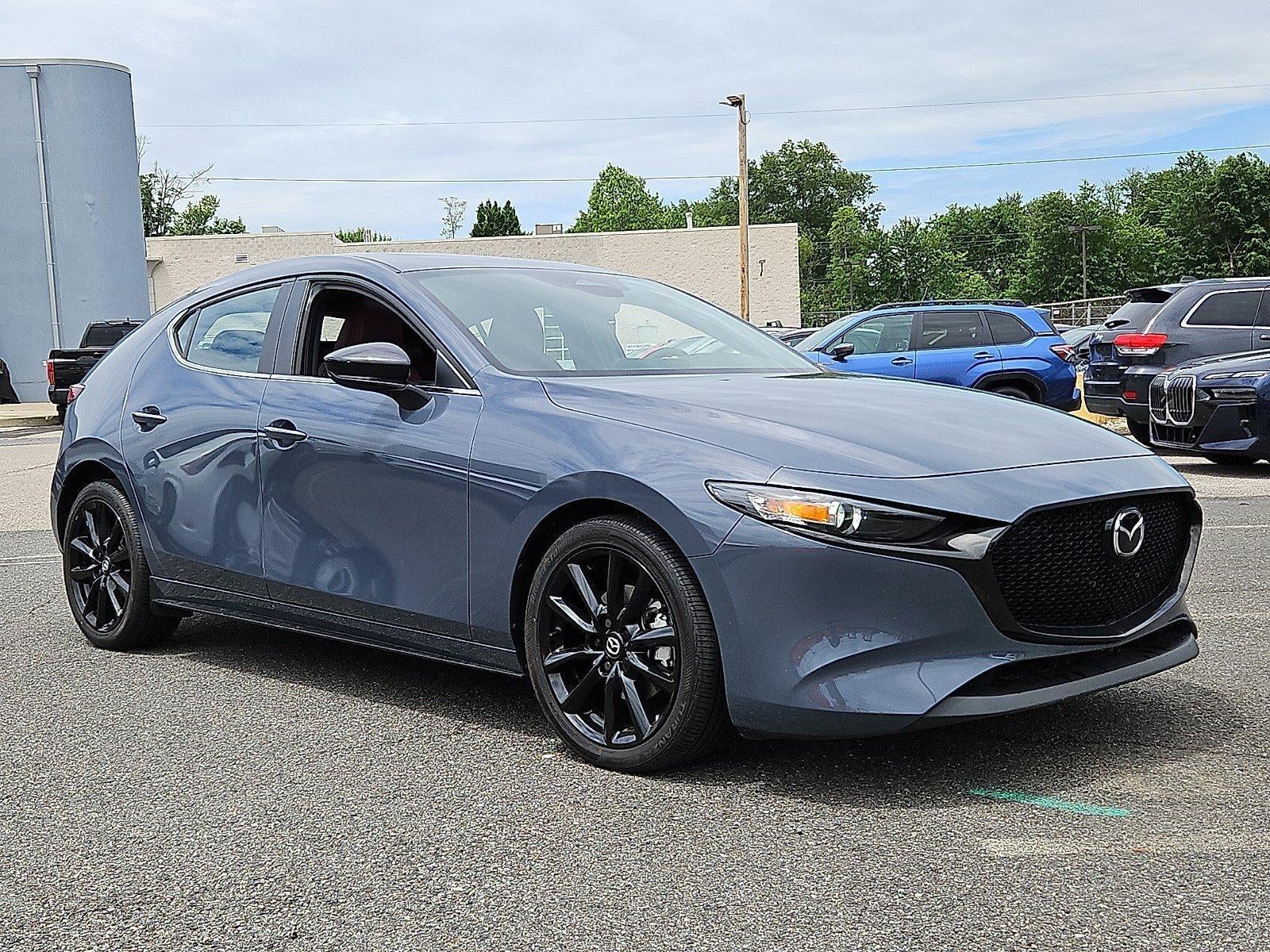2025 Mazda Mazda3 Hatchback 2.5 S Carbon Edition AWD in Polymetal Gray Metallic — front three-quarter view