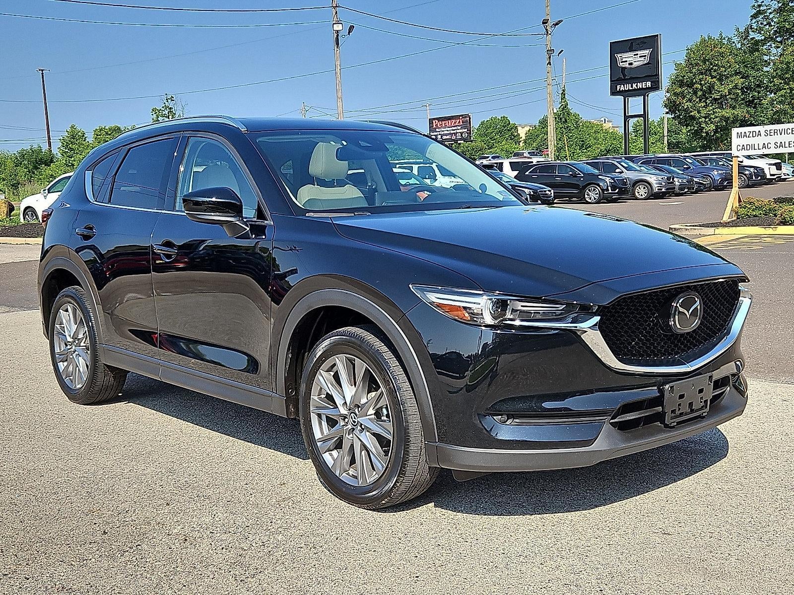 2021 Mazda Mazda CX-5 Grand Touring AWD in Jet Black Mica — front three-quarter view