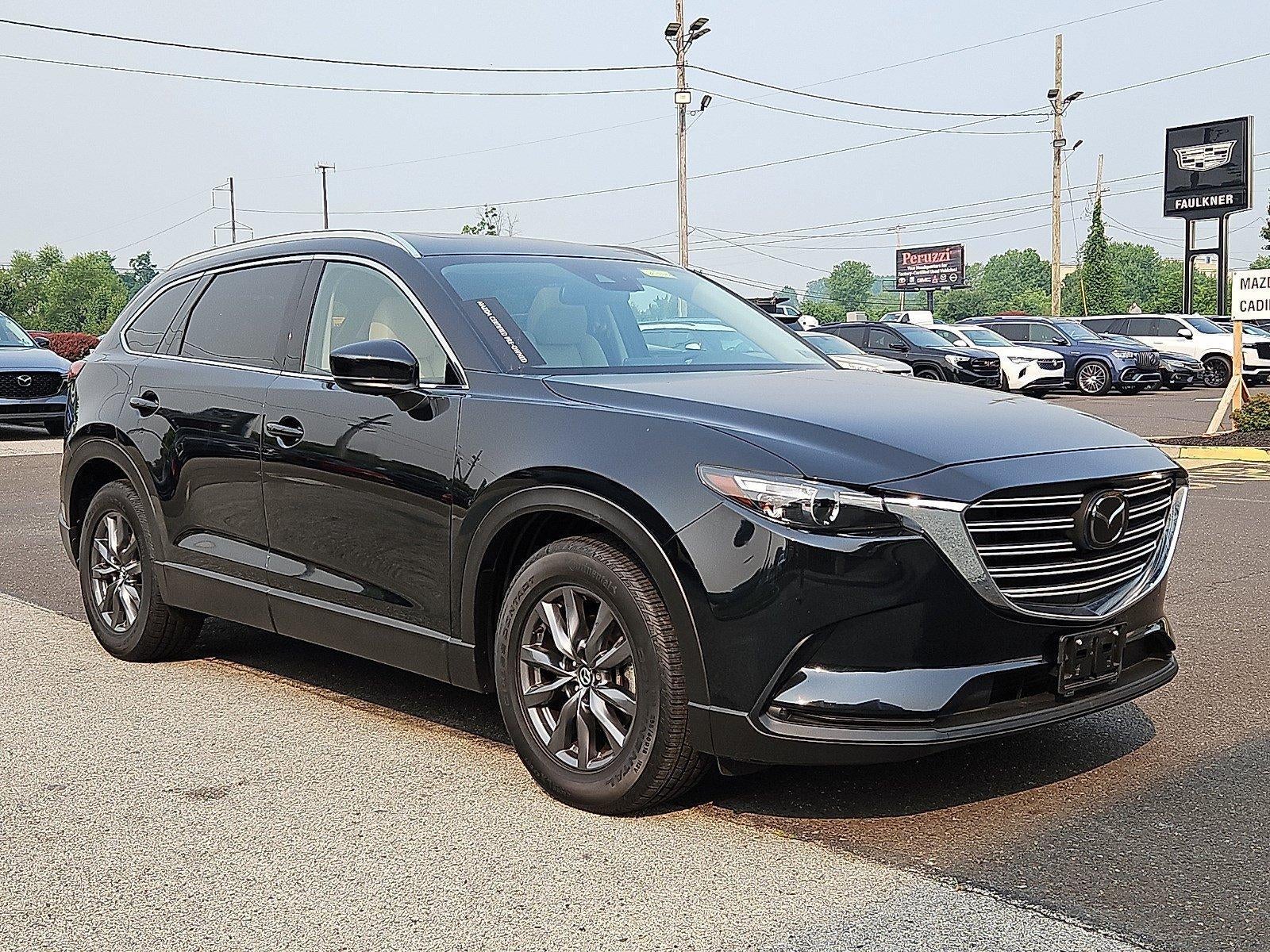 2023 Mazda Mazda CX-9 Touring AWD in Jet Black Mica — front three-quarter view