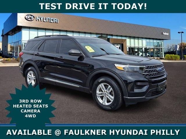 2023 Ford Explorer XLT 4WD in Agate Black Metallic — front three-quarter view